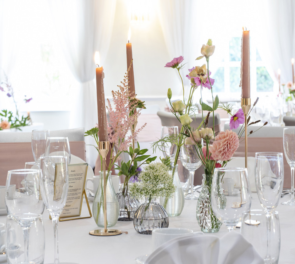 Wedding table set up with flowers and candles