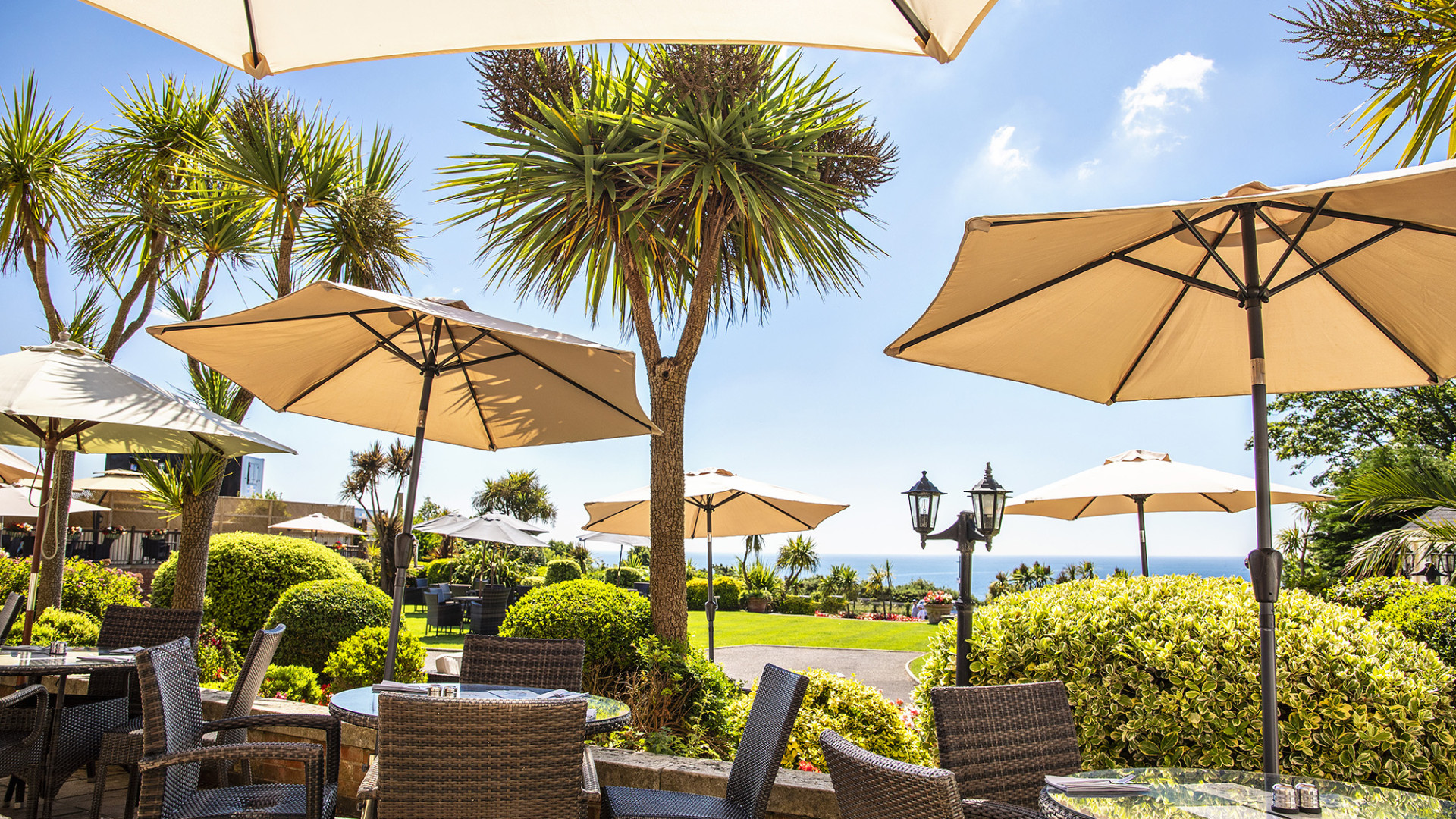 Parasols set up on terrace tables