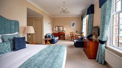 Large bedroom with blue furnishings