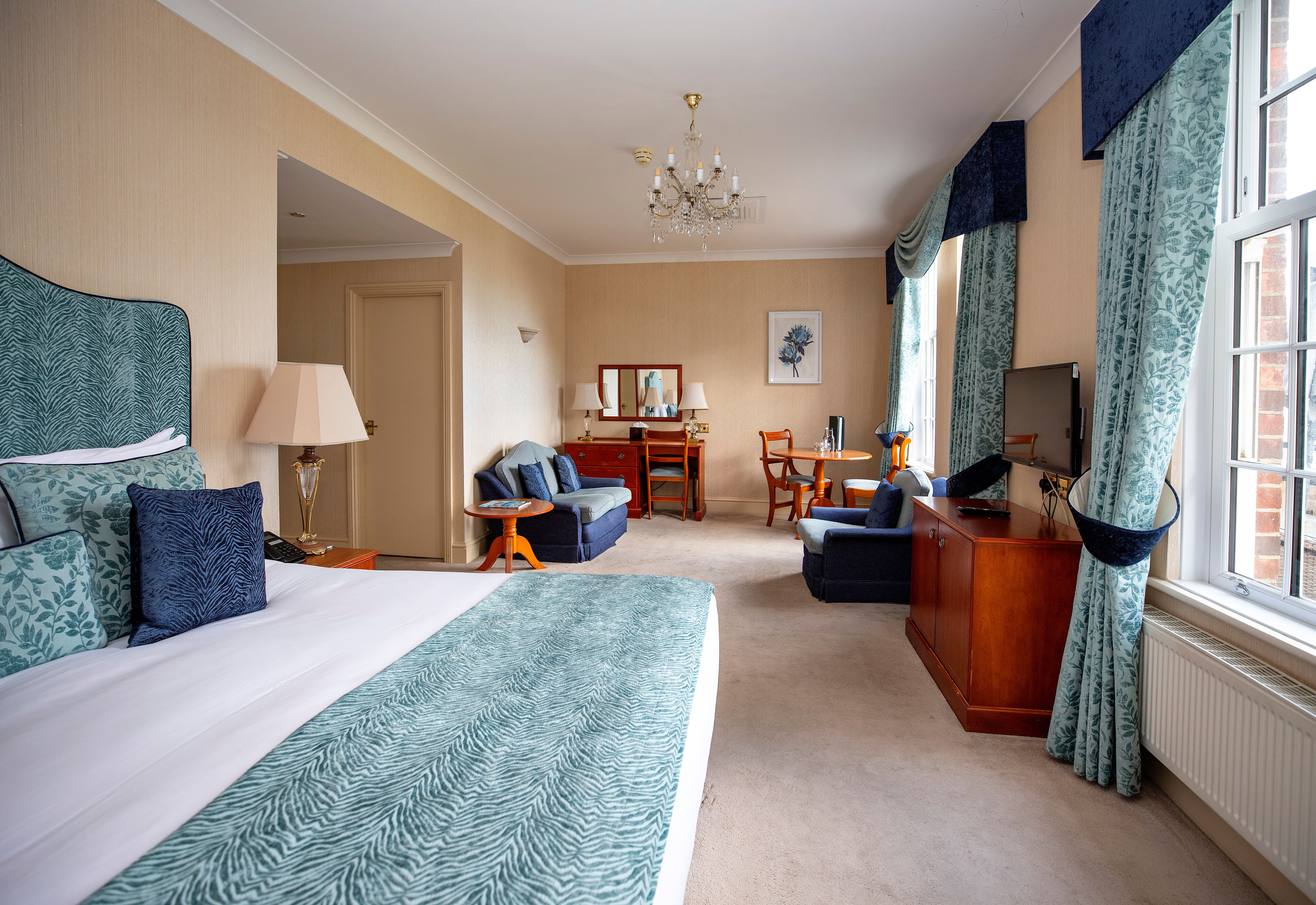 Large bedroom with blue furnishings