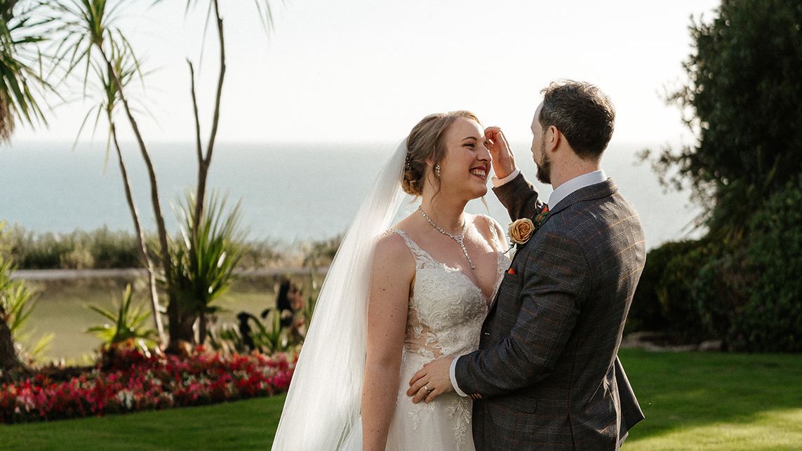 Bride and Groom overlooking the sea from Miramar gardens