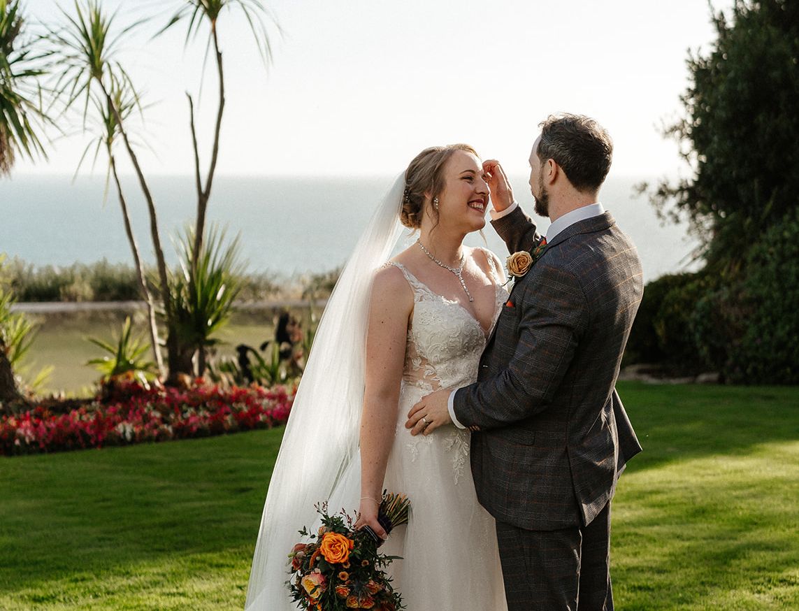 Bride and Groom overlooking the sea from Miramar gardens