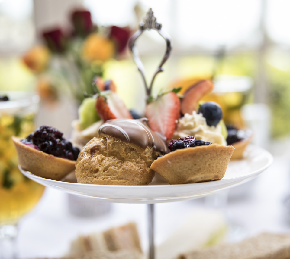Top tier of afternoon tea stand with sweet desserts