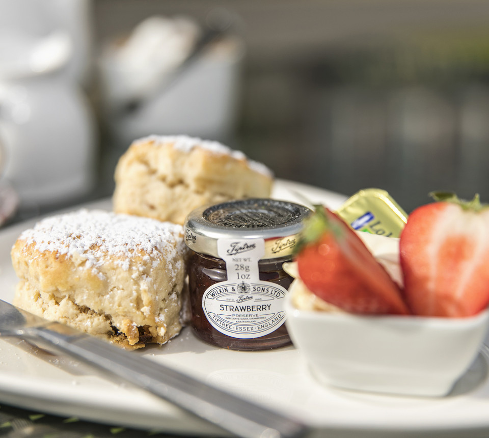 Close up cream tea scones with strawberries