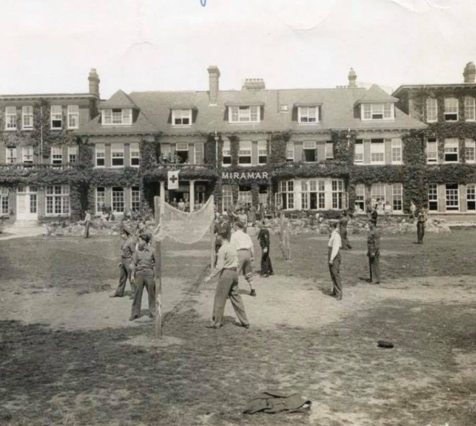 Black and white photo of hotel in past