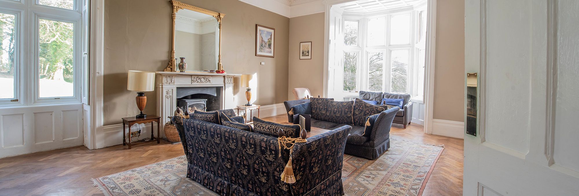 stunning lounge with cosy fire and large windows