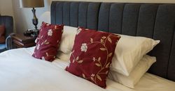 hotel bed with luxury cushions and bedding