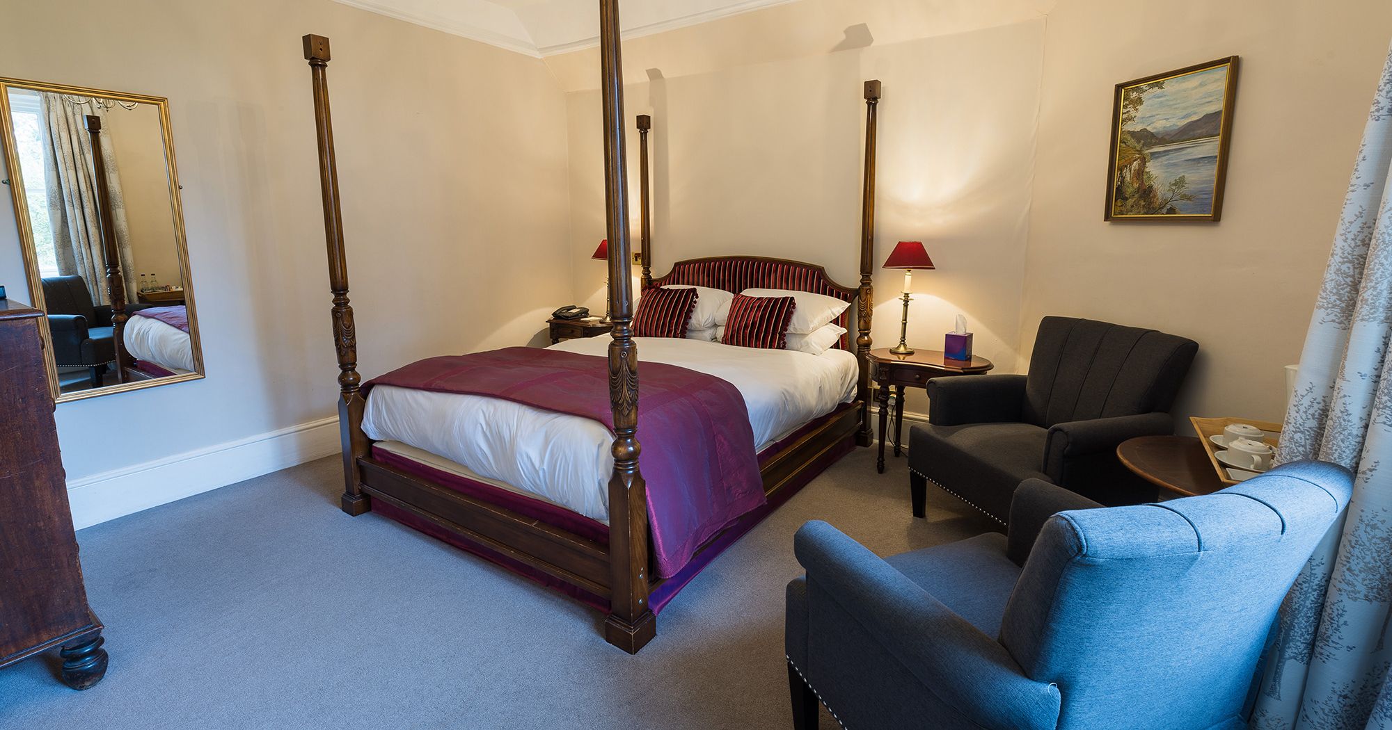 hotel bedroom with four poster hotel bed