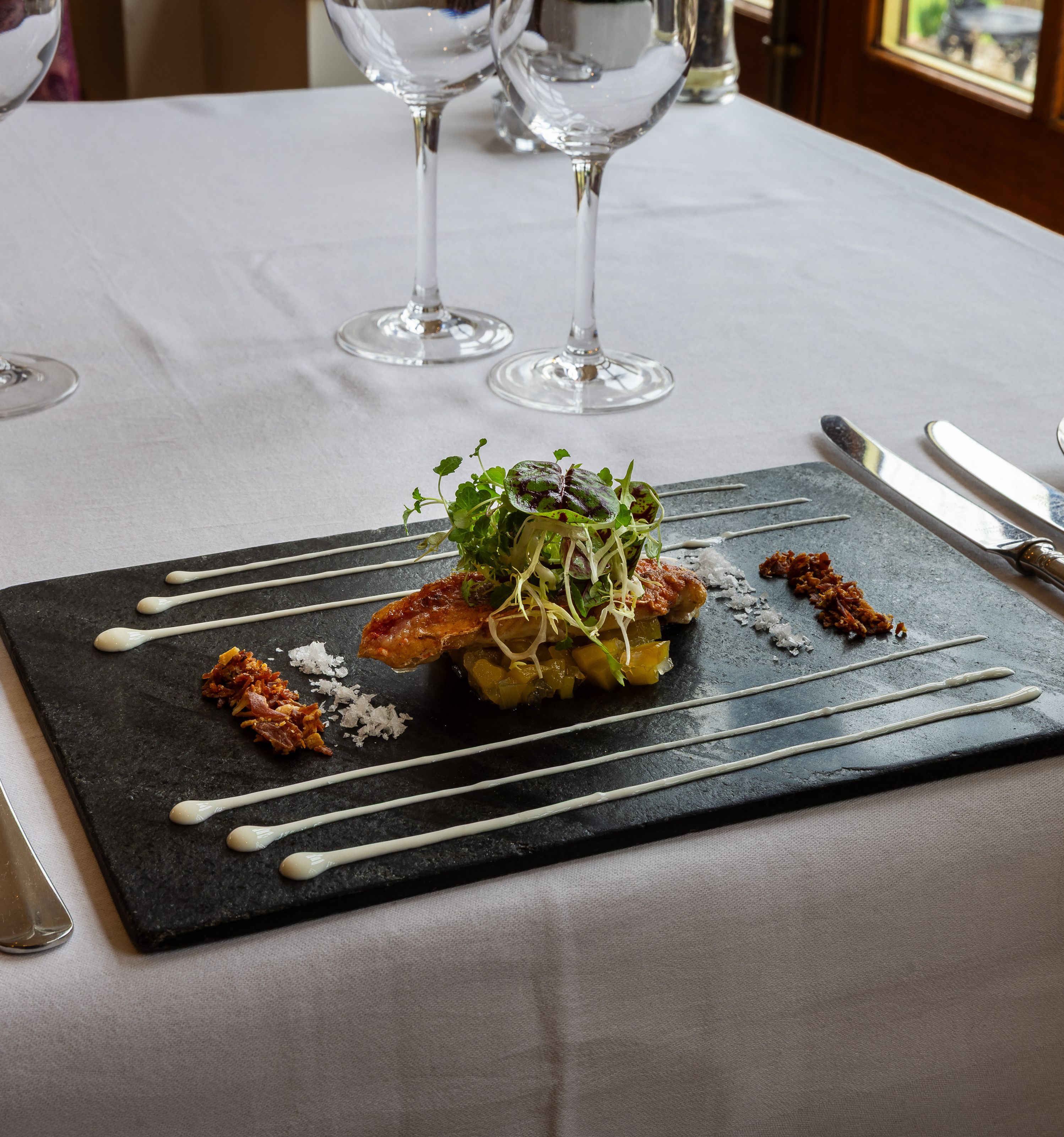 pork on a bed of apple sauce