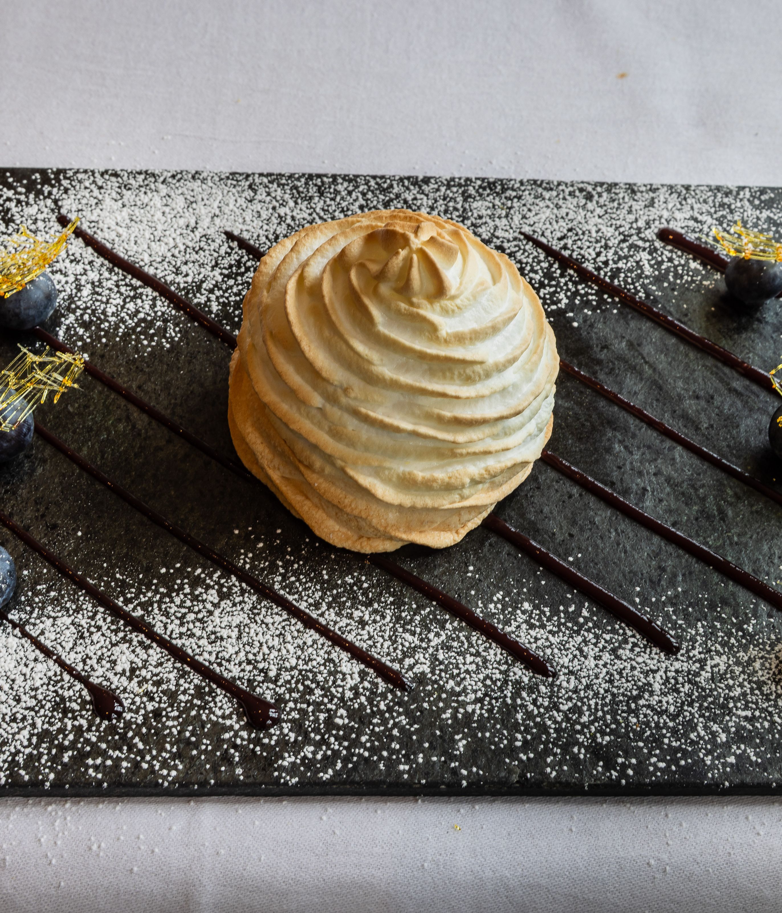lemon meringue pudding on a slate board
