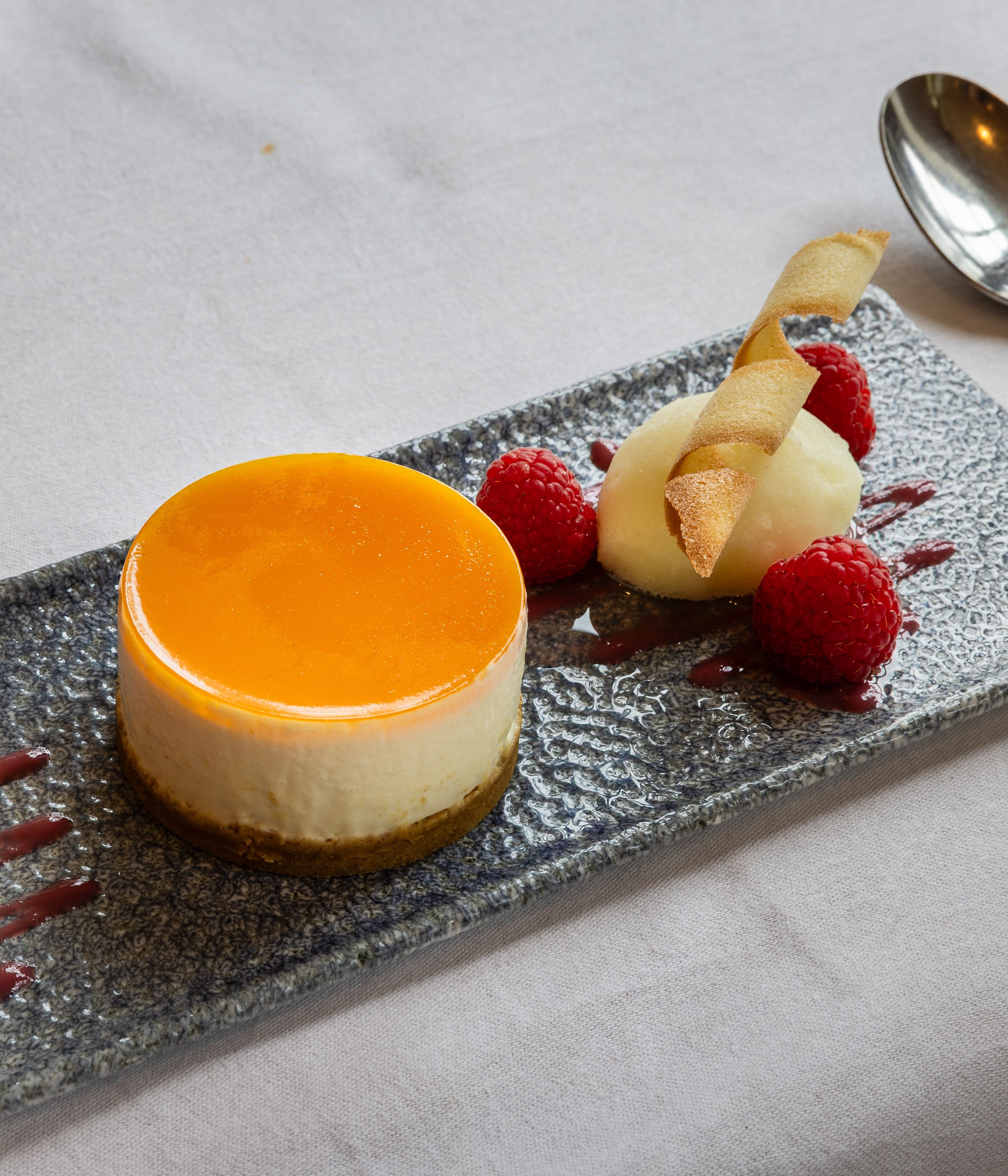Cheesecake on a slate with berries