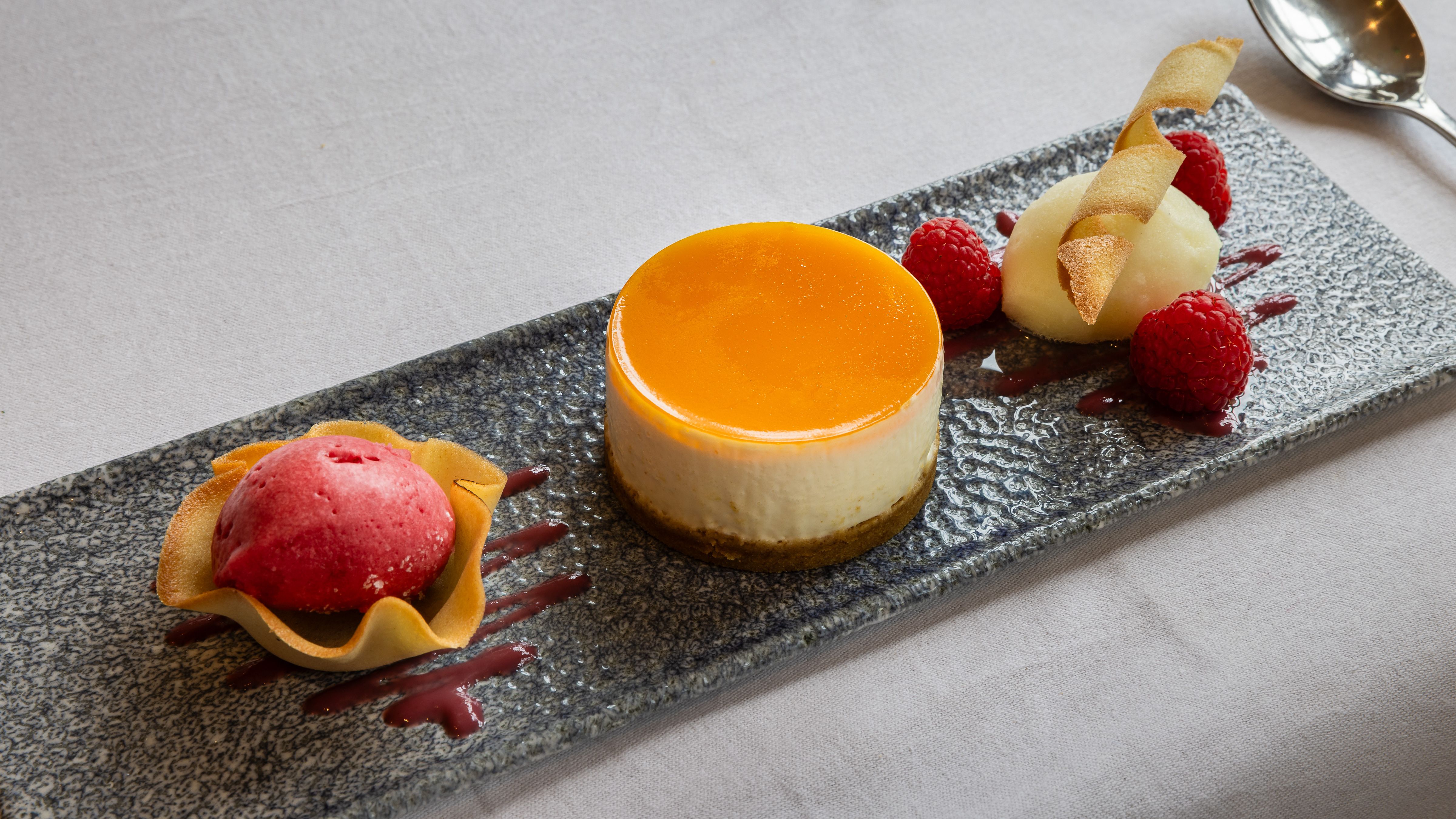 Cheesecake on a slate with berries