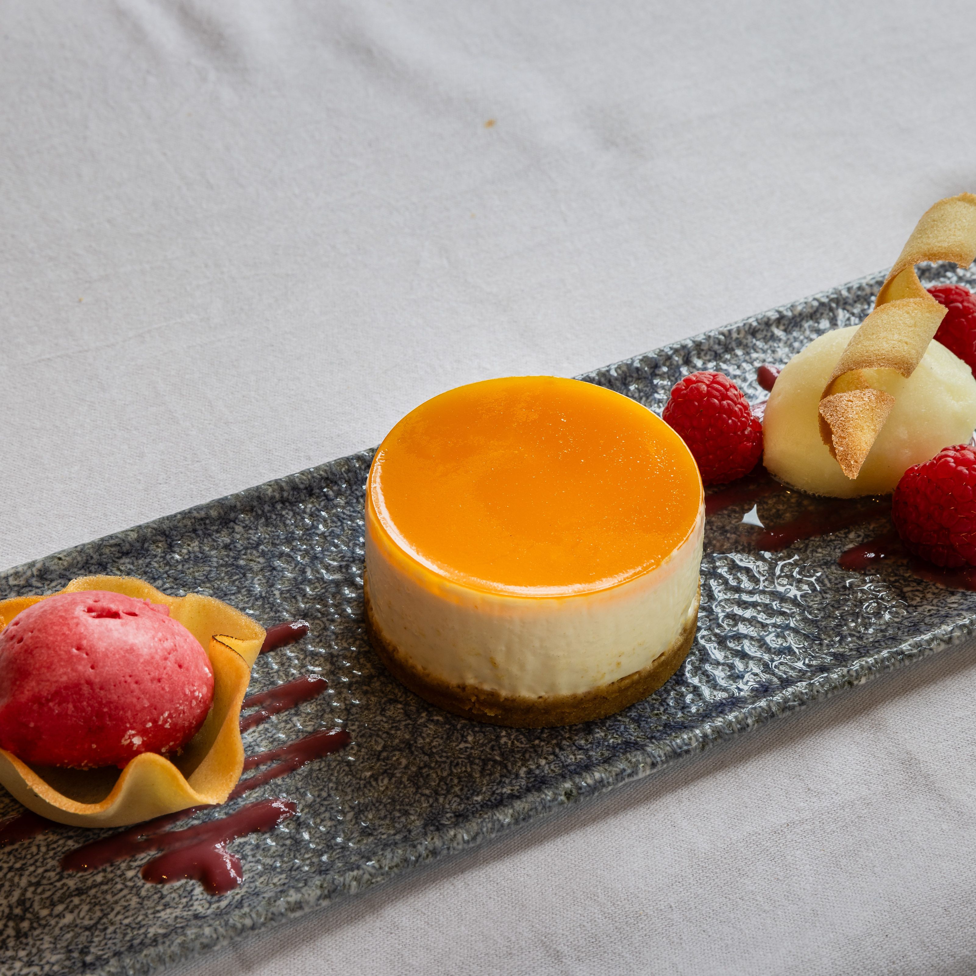 Cheesecake on a slate with berries