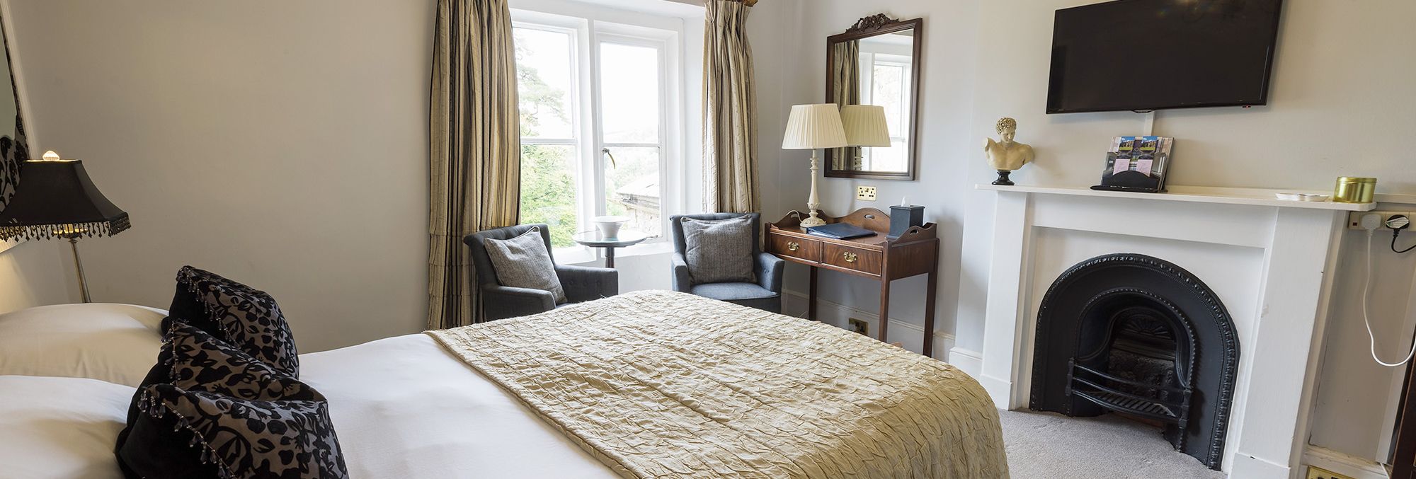 vintage style hotel room with feature fireplace