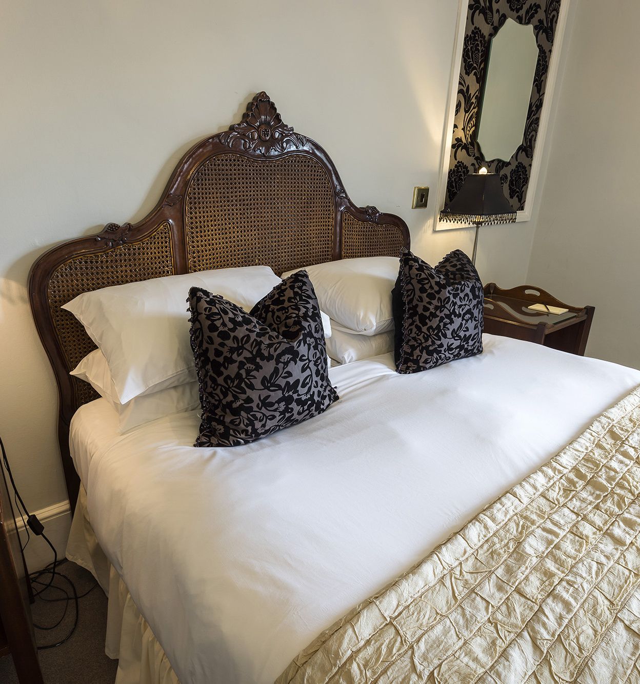 hotel bed with luxury cushions and bedding