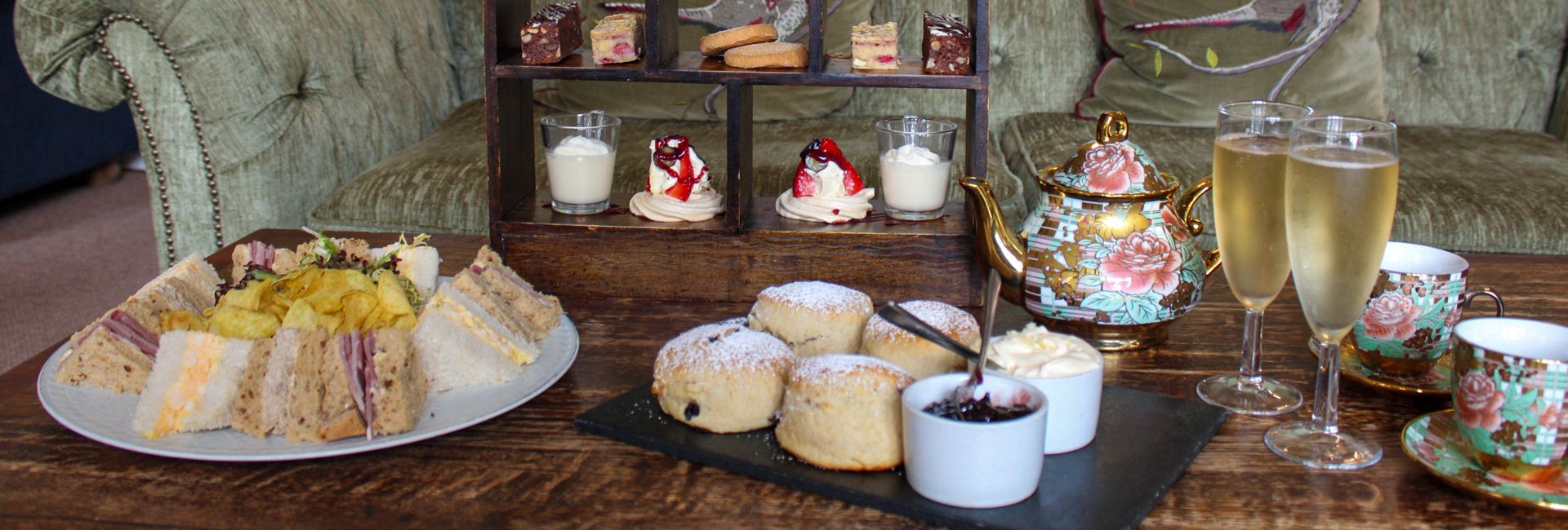 afternoon tea with scones, sandwiches, prosecco and small bites.
