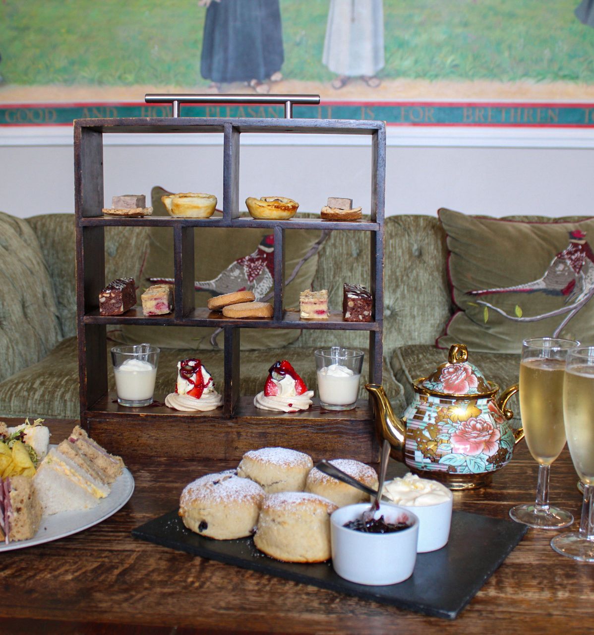 afternoon tea with scones, sandwiches, prosecco and small bites.