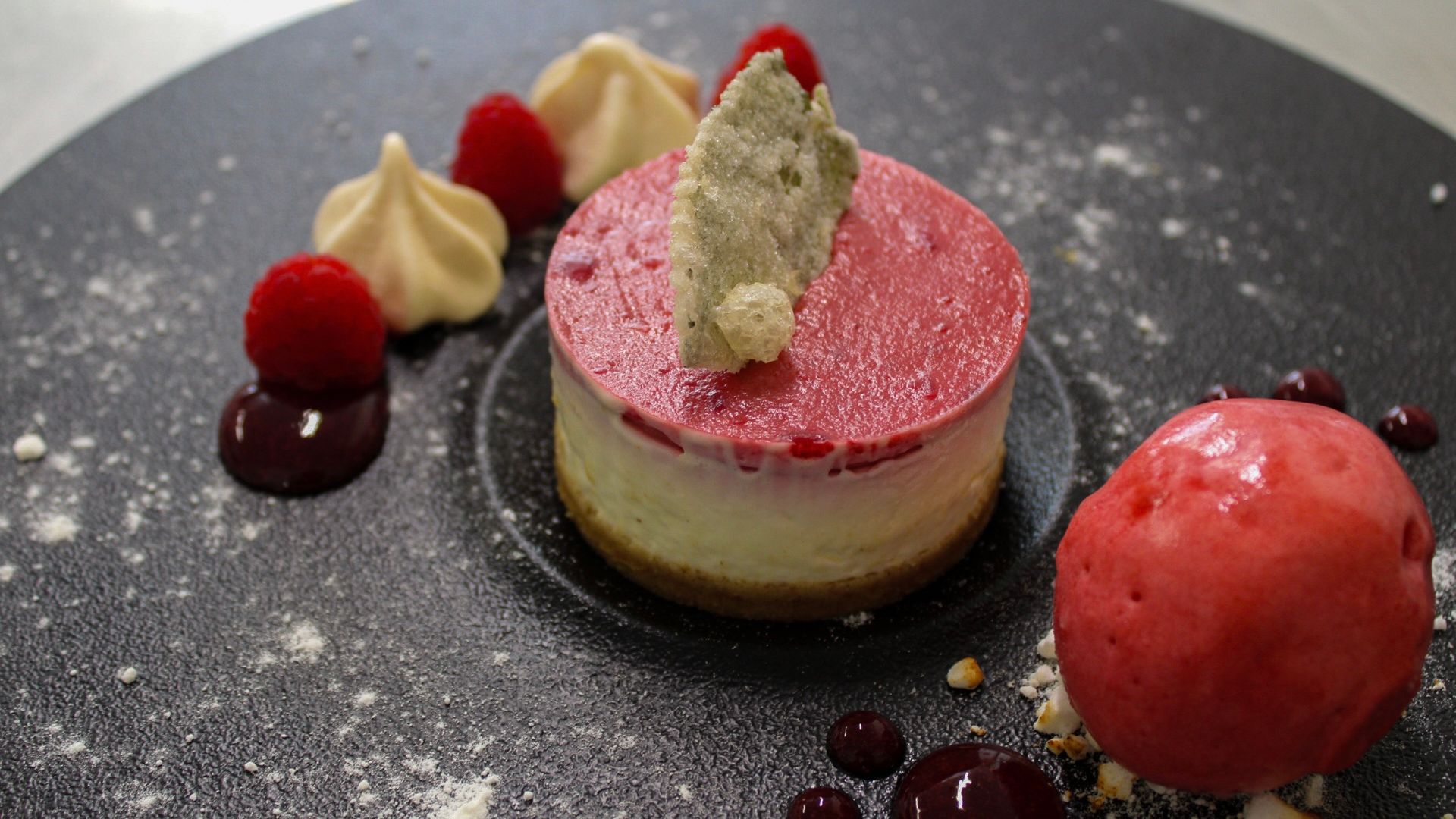 eton mess cheesecake with raspberry sorbet, candied mint leaves and fresh berries