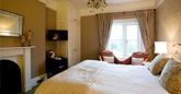 Chulmleigh bedroom with large bedroom and ornate fireplace