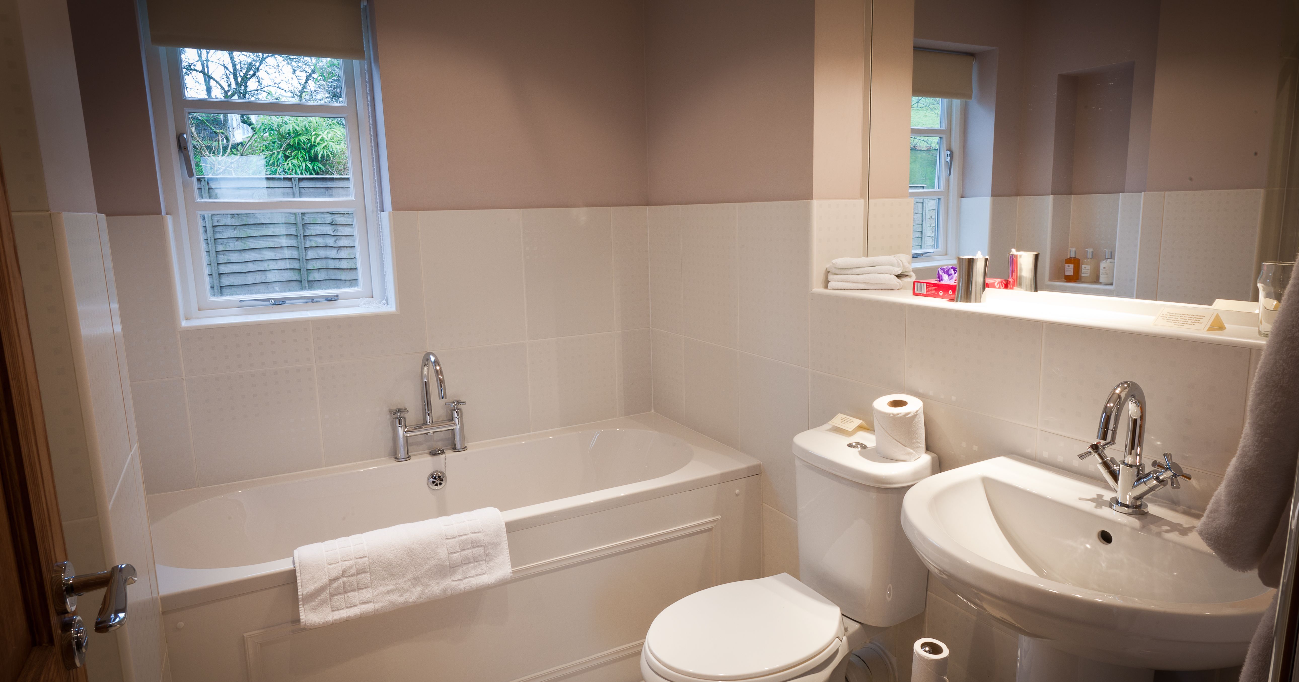 Dragonfly Bathroom with bath and large mirror