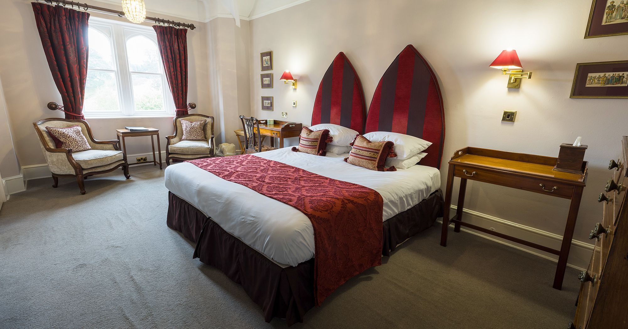 gothic inspired hotel room with table and chairs