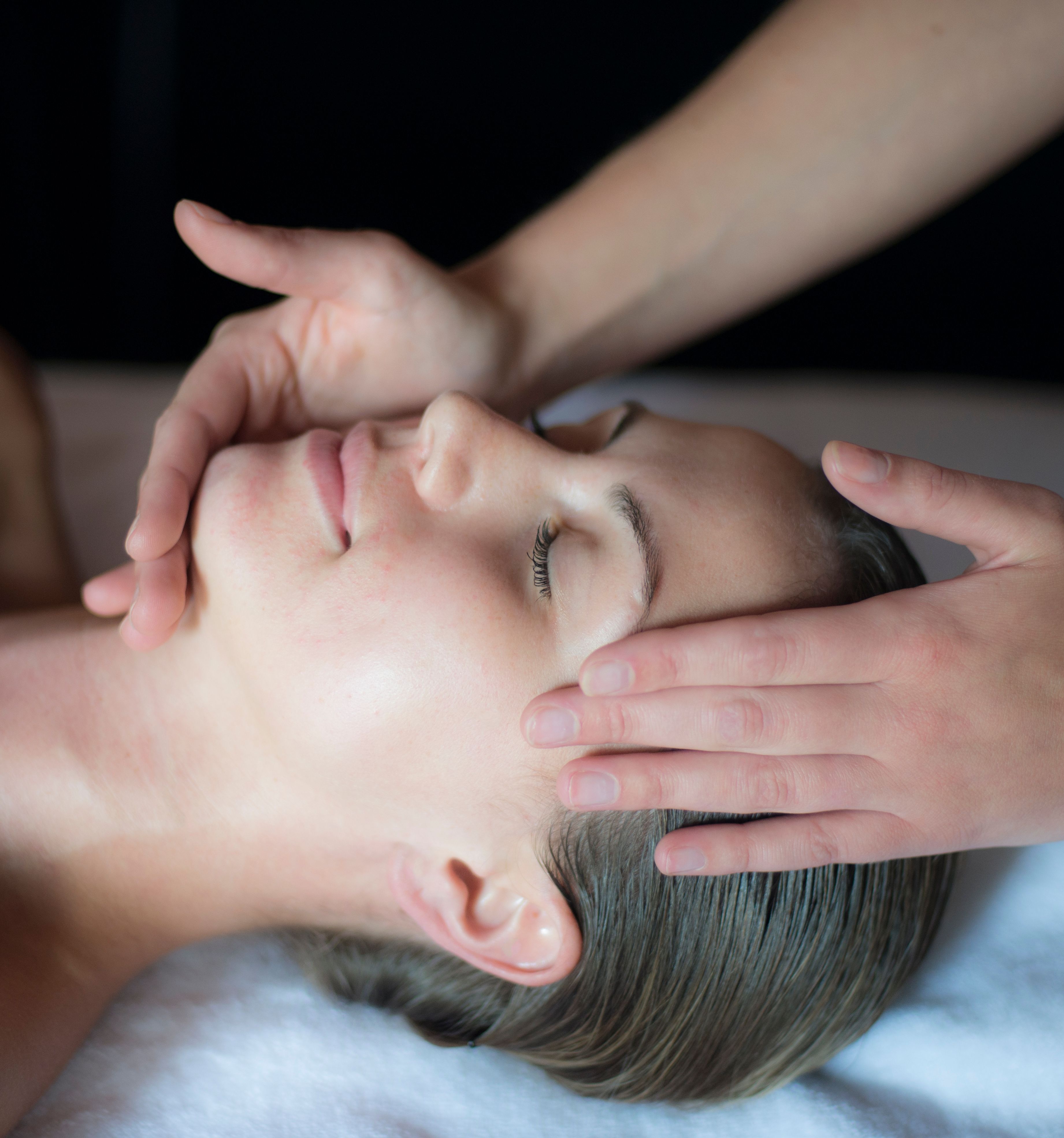 Person receiving a relaxing facial massage