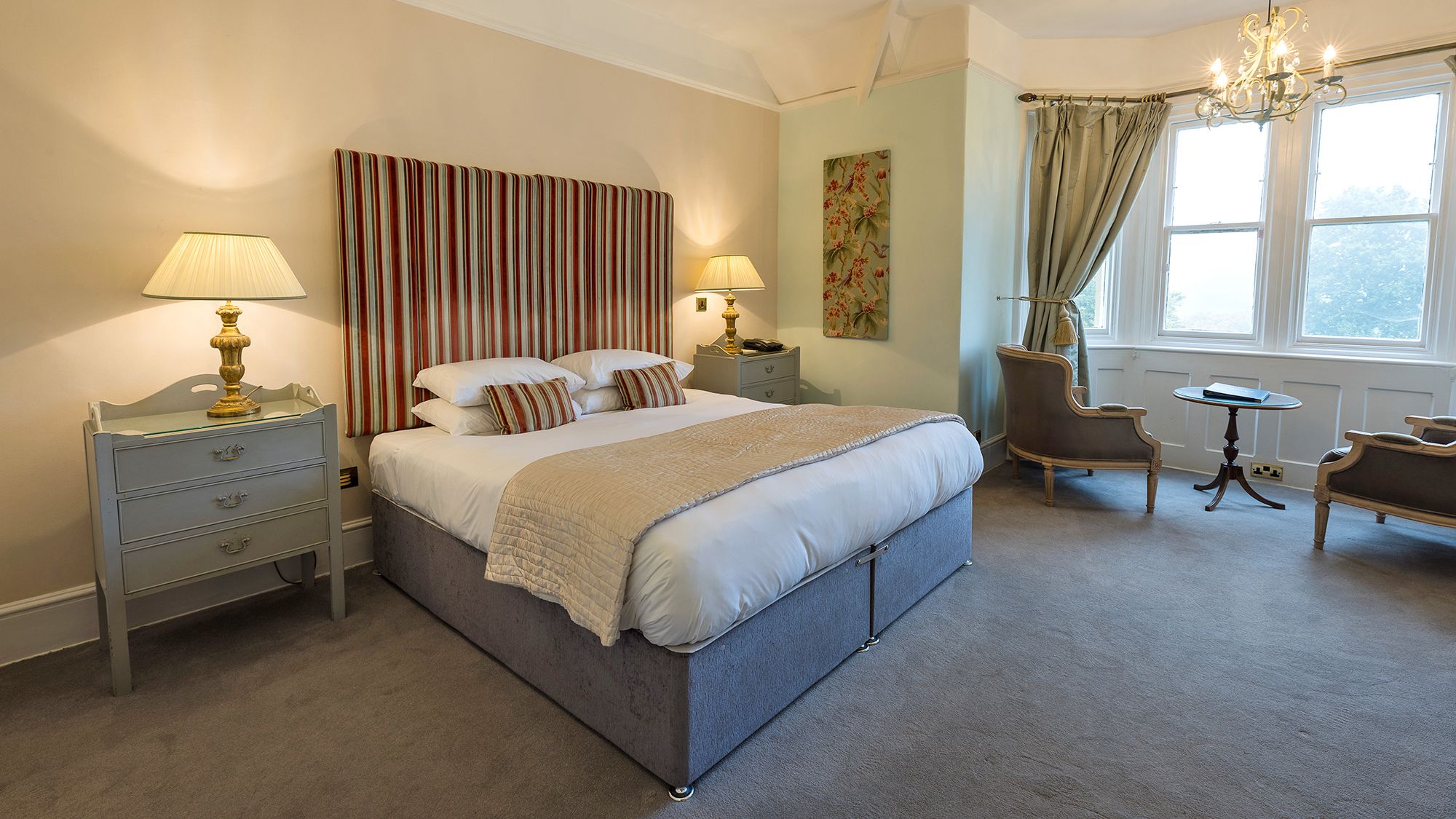 light and bright hotel bedroom with statement headboard