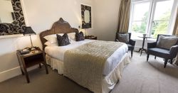 hotel bedroom with statement mirrors