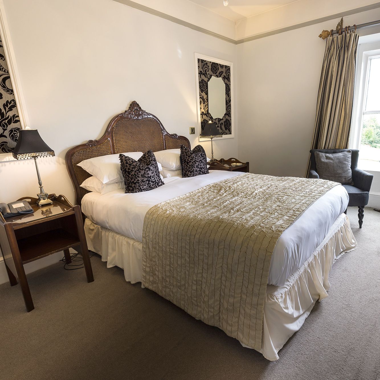 hotel bedroom with statement mirrors