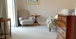 large hotel suite with sofa