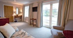 large hotel suite with sofa