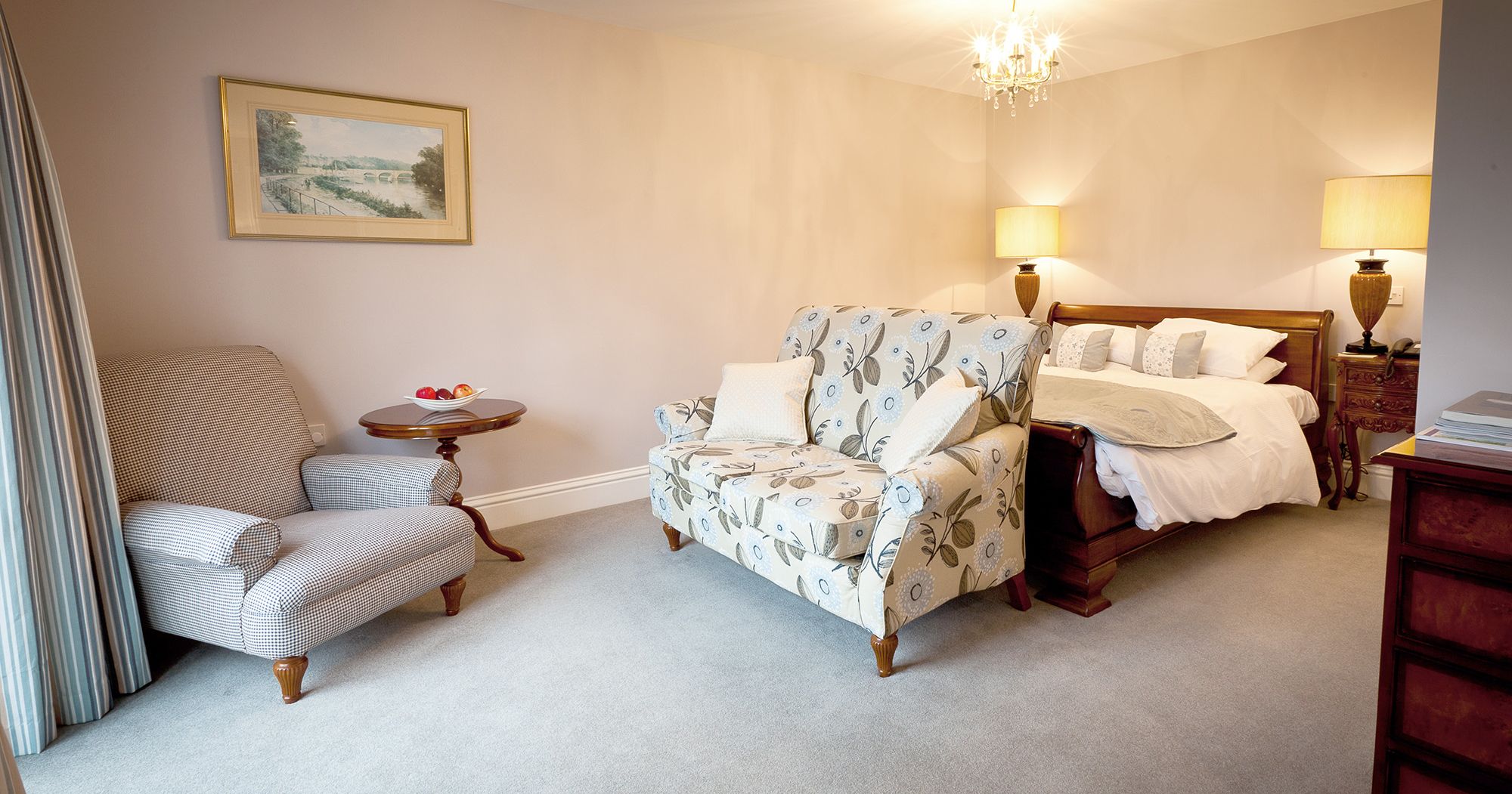 peaceful and large hotel suite with sofa