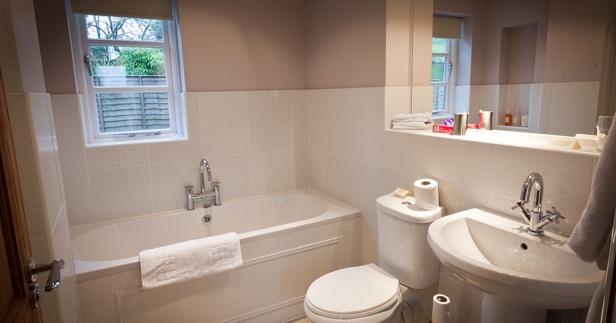hotel bathroom with bath