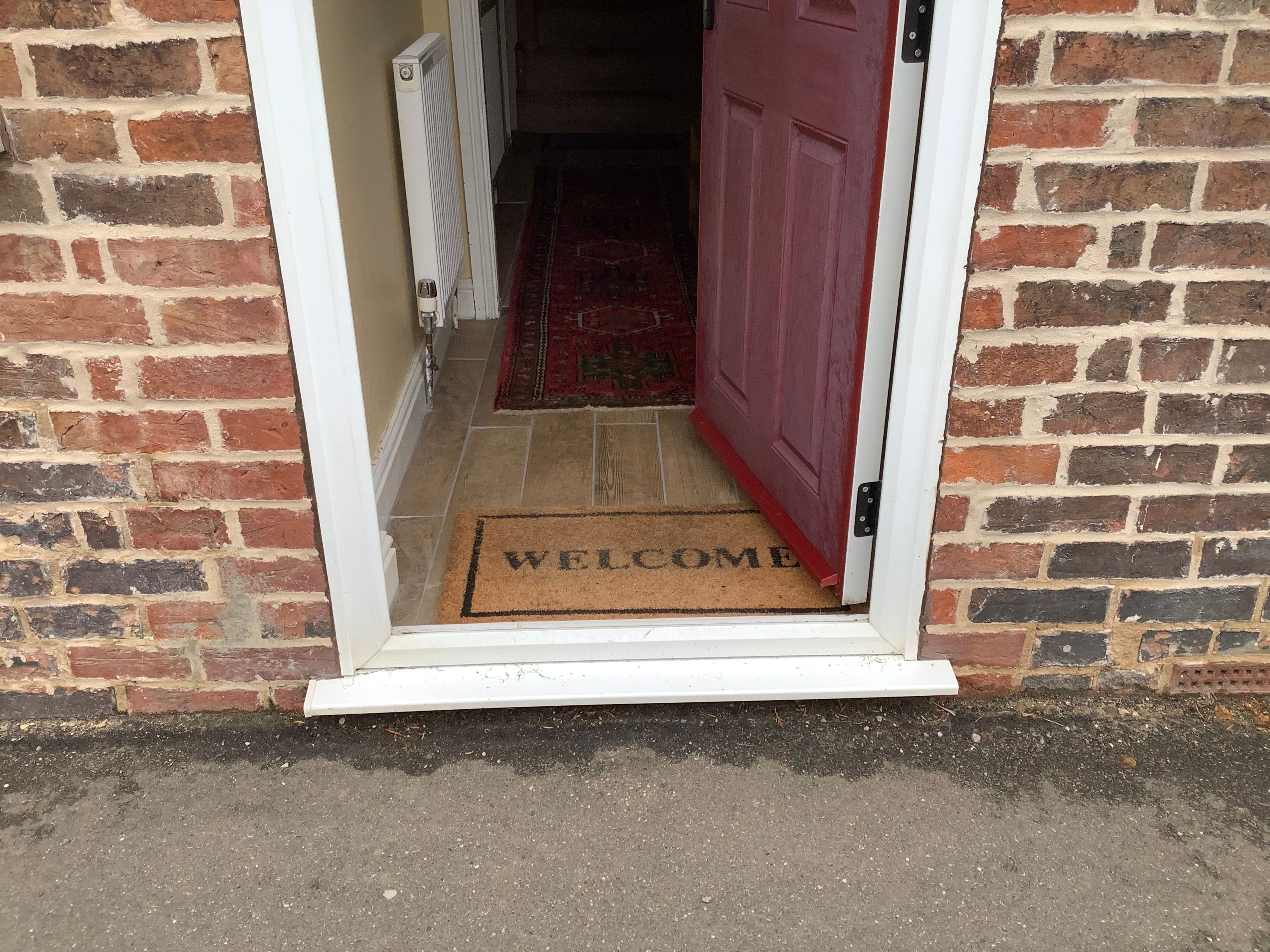 entrance step and welcome mat at the Front Door of The Old Posthouse B&B