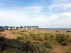 Beach and beach huts at Chapel St Leonards