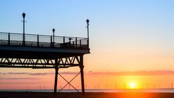 Pier at Skegness with sunsetting in the background