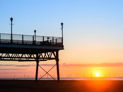 Pier at Skegness with sunsetting in the background
