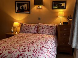 Double bed and side tables of Bedroom 2