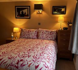 Double bed and side tables of Bedroom 2