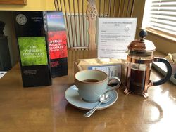 Menu of teas and coffees for breakfast with selection of teas and cup of coffee