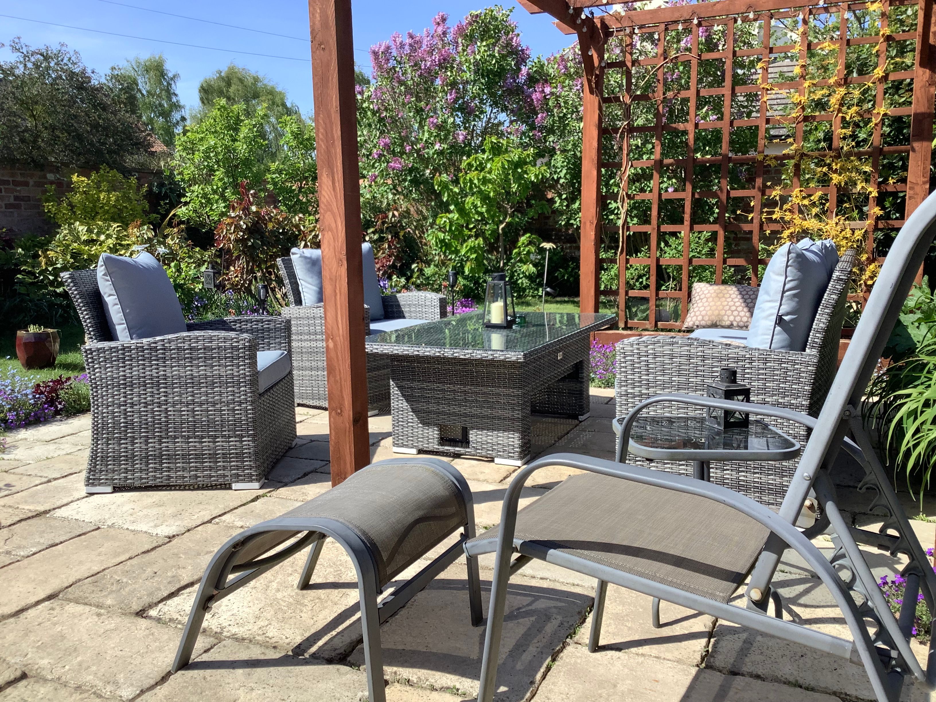 Patio with garden sofa set and lounging chair