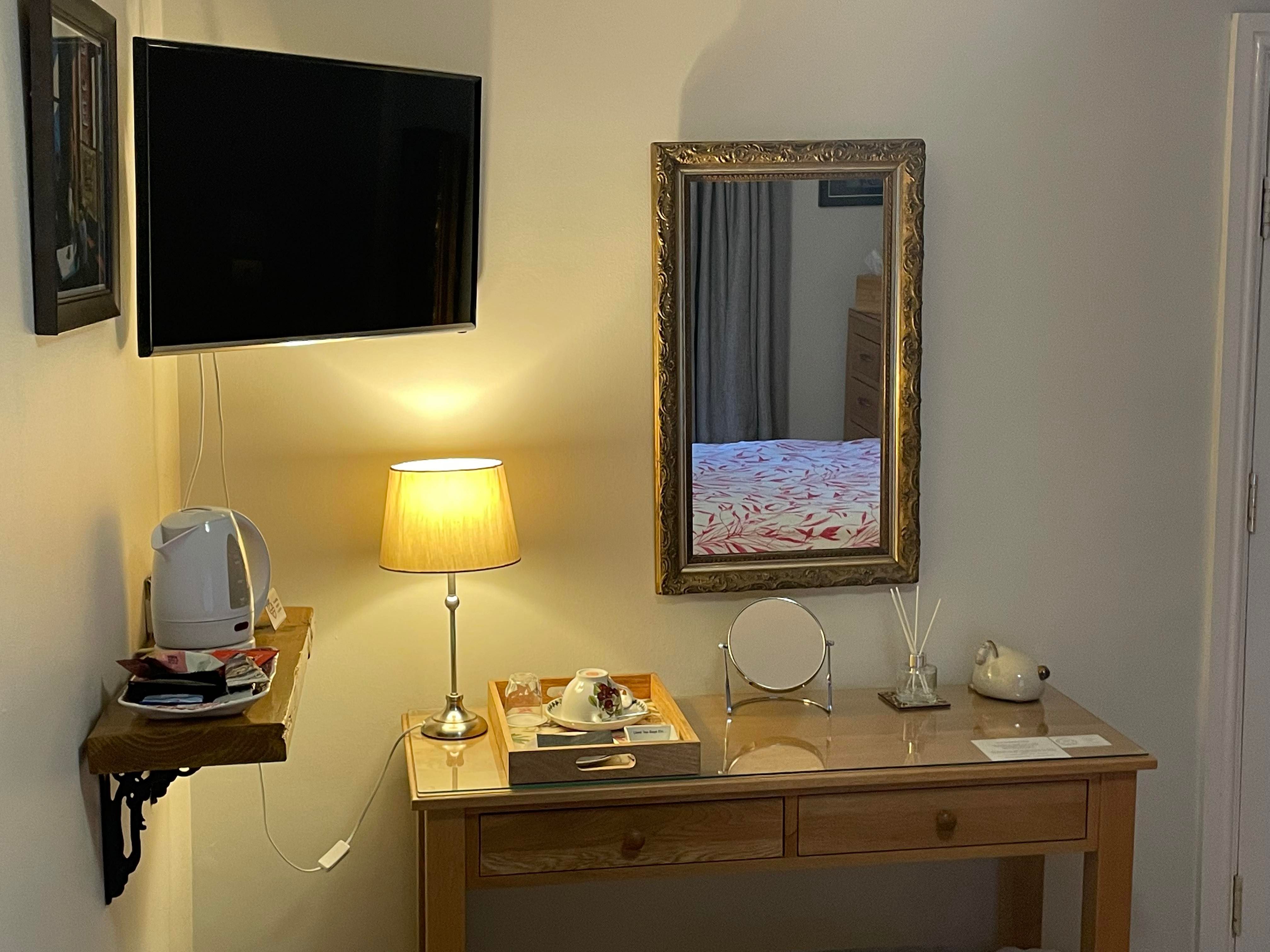 Dressing table, mirror, TV and hospitality tray of Bedroom 2