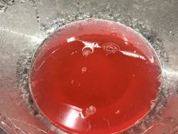 Rhubarb juice from baked rhubarb in a glass bowl