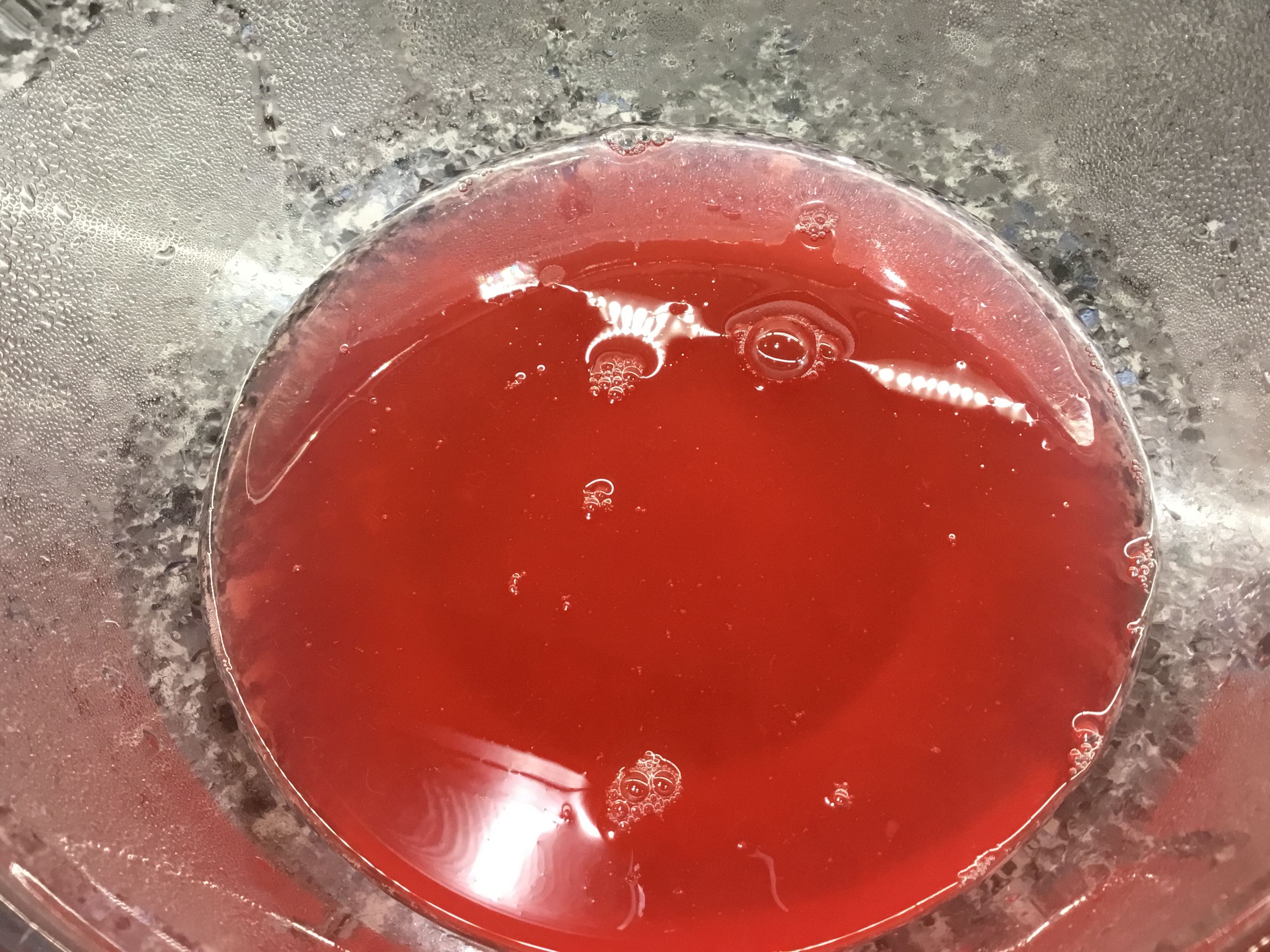 Rhubarb juice from baked rhubarb in a glass bowl