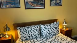 Kingsize bed in Bedroom 3 with bedside table and lamps