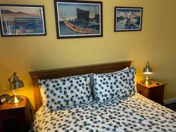 Kingsize bed in Bedroom 3 with bedside table and lamps