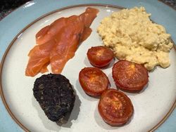 Scrambled Eggs, Alfred Enderby smoked salmon, black pudding and tomatoes