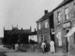 old picture of the front of the Old Posthouse when it was the village shop