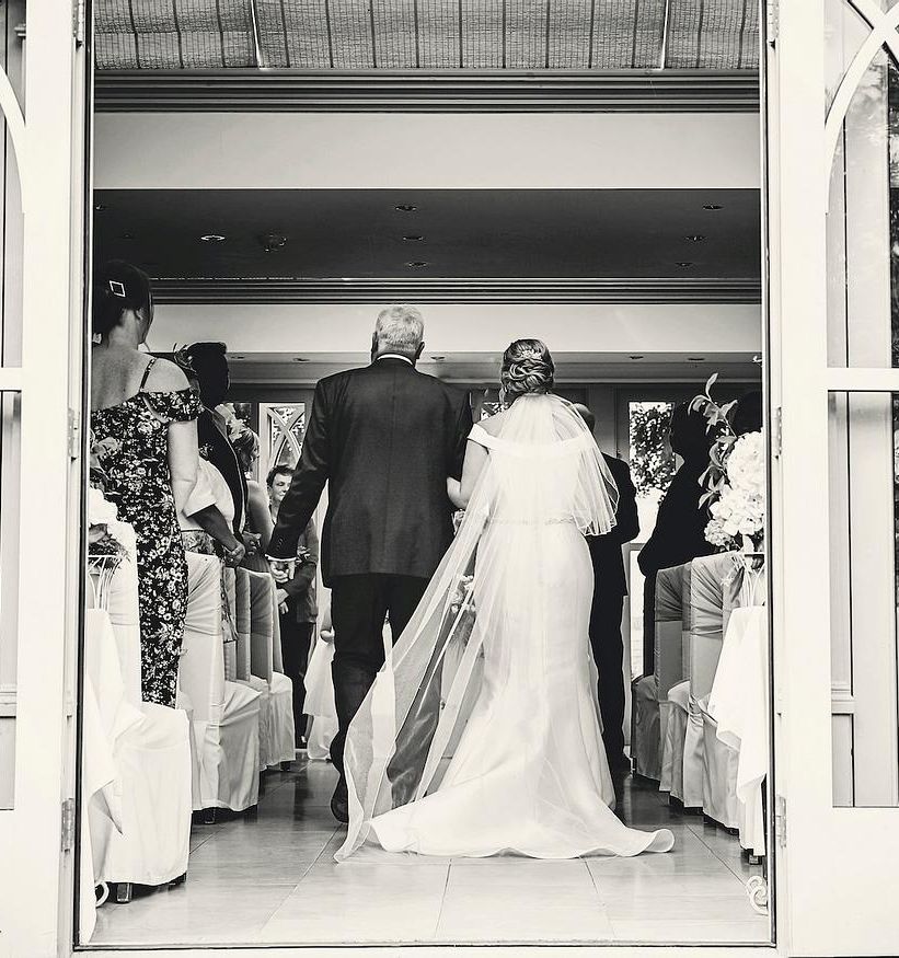 A bride walking down the aisle.