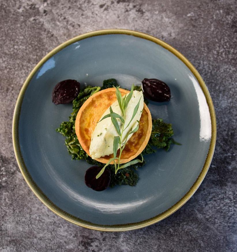 A tart displayed on a plate.